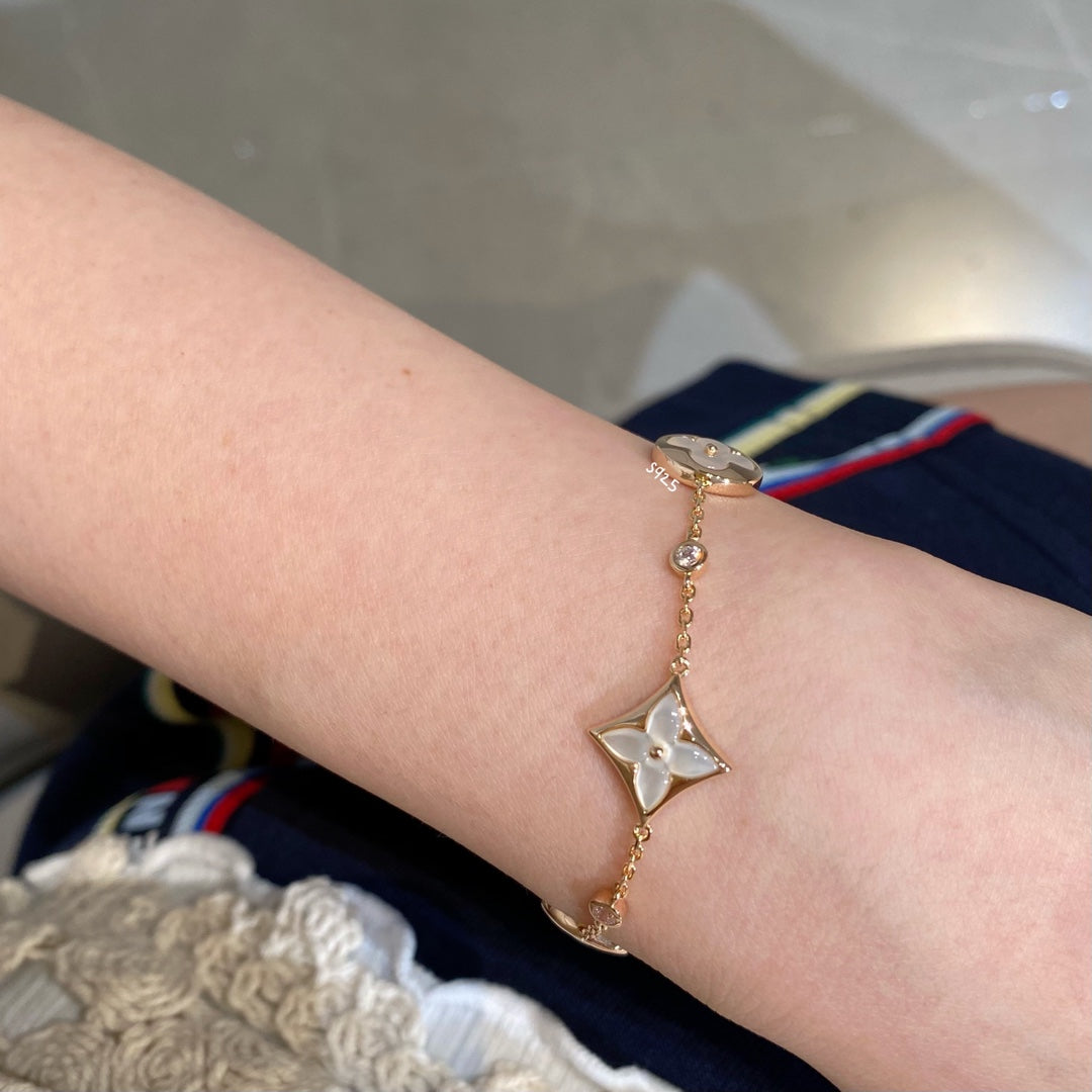 [moco jewelrys]STAR AND SUN 4 MOTIF WHITE MOP PINK GOLD BRACELET